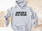 Load image into Gallery viewer, Abortion is healthcare Hoodie
